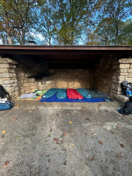 ACE students sleep outside under a lean-to in the Pound Ridge Camping Trip