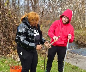 Two ACE students at Bennett Memorial Park are planting baby trees.