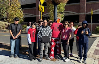 ACE students with Daniela posing with our scarecrow in Danbury