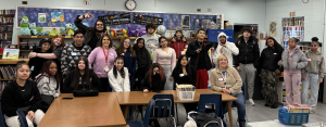 ACE Students gather in the library at Pembroke Elementary School after reading to the students.