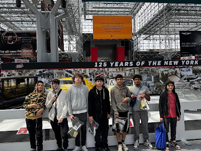 ACE students pose for a picture at the NYC Auto Show.