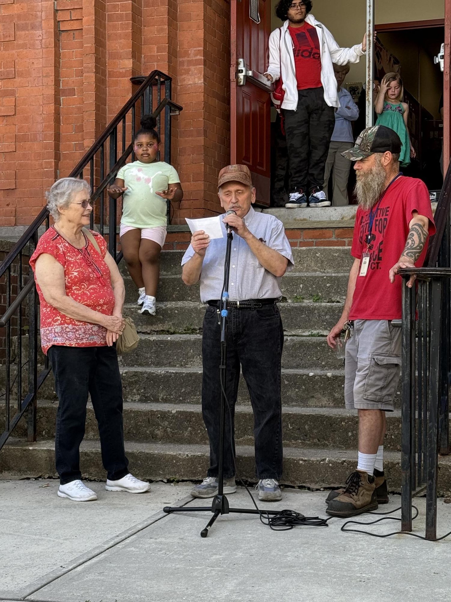 Representatives from The Old Timers Association announce a contribution to the ACE outdoor activity fund.
