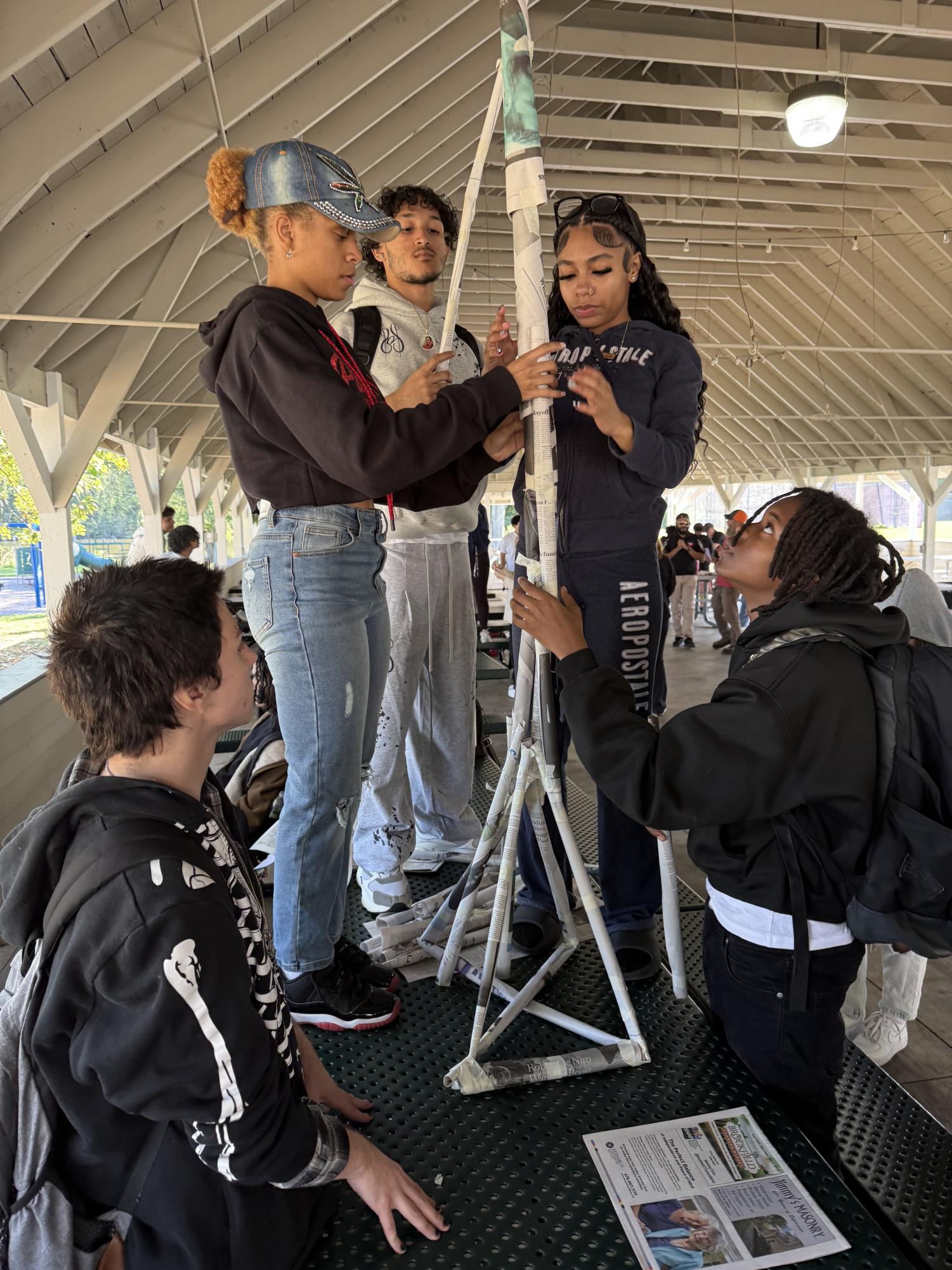 Jasper, Kiki, Josiah, Lamara and Azaire work together to build the winning Tower of Power.
