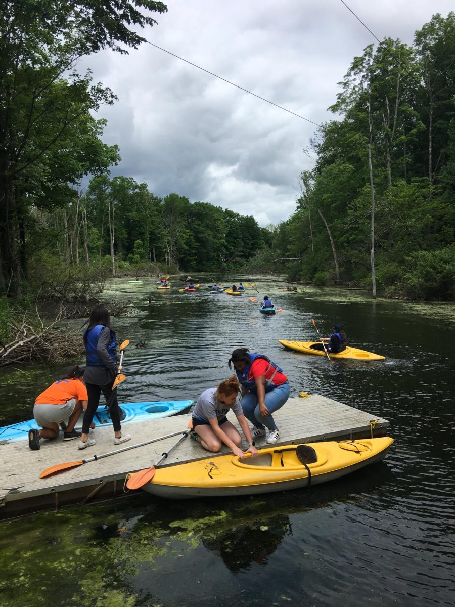 Students in 2018 enter the Hudson River near Lake George, NY for a white water rafting adventure.